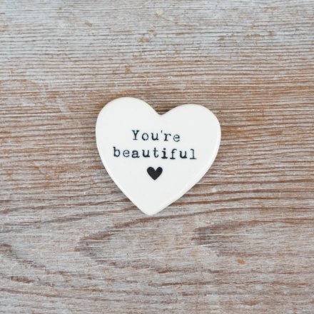 A charming pocket sized keepsake token with an embossed 'you're beautiful slogan'.