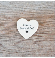 A charming pocket sized keepsake token with an embossed 'you're beautiful slogan'.