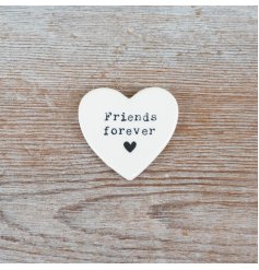 A charming porcelain heart keepsake, perfect for celebrating lifelong friendships.