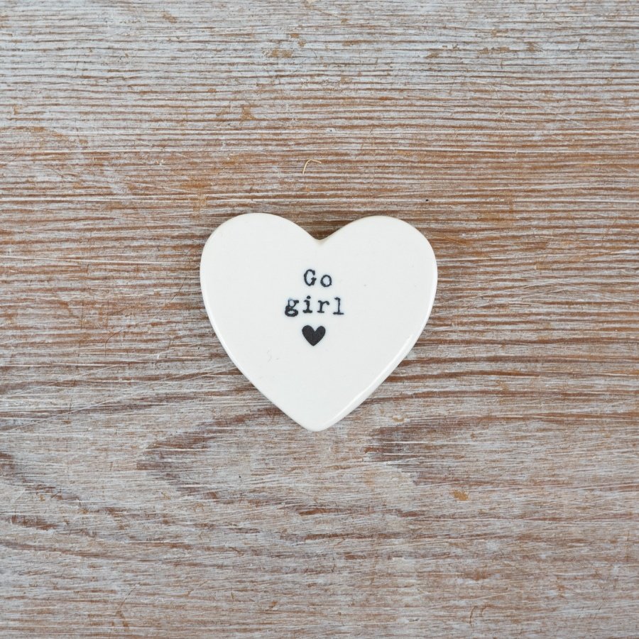 White glazed heart token featuring black text and a delicate heart design.