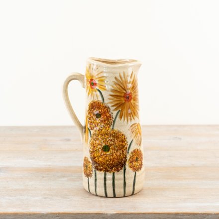 This charming rustic jug showcases warm hues of burnt orange and bright buttercup yellow.
