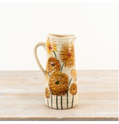 This charming rustic jug showcases warm hues of burnt orange and bright buttercup yellow.