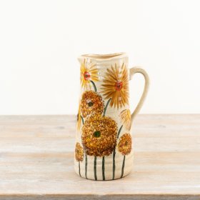 This charming rustic jug showcases vibrant burnt orange and warm buttercup yellow hues.