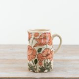 A charming vase imitating a jug shape adorned with gorgeous Poppy illustrations. 
