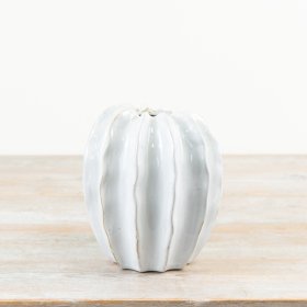 Meet this botanical pod vase, elegantly coated in a smooth off-white glaze.