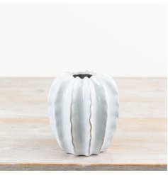 A chic on trend pod vase finished with an off white glaze. 