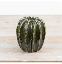 Beautiful green pod-shaped vase featuring a smooth, glossy glaze finish.