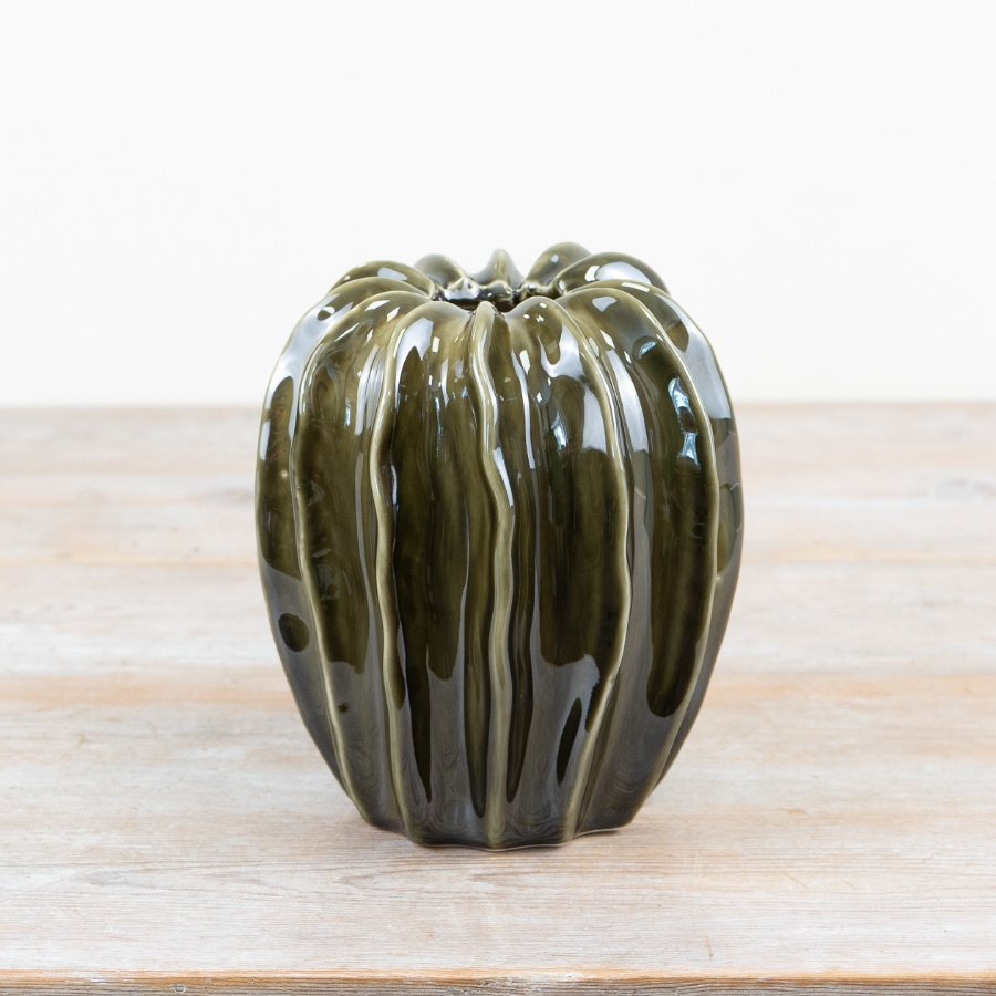 Elegant ceramic pod vase with a sleek emerald green glaze finish.