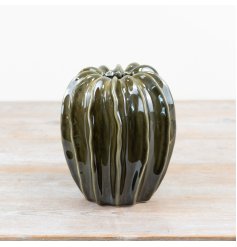 A gorgeous pod vase made from ceramic and finished with an emerald green glaze.