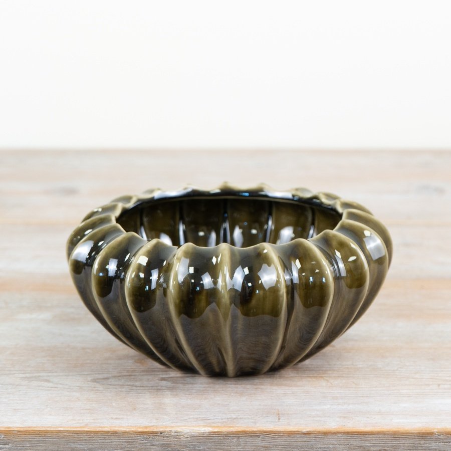 Bring tranquility to your space with this olive green statement pod bowl vase.