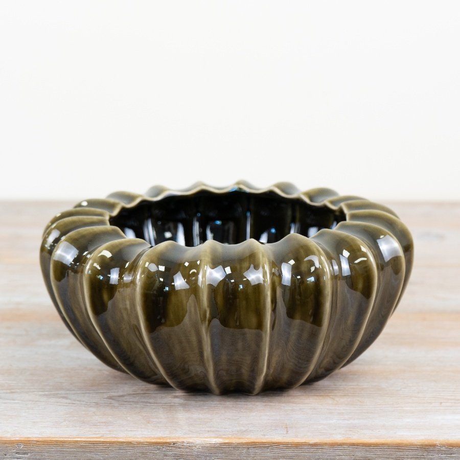 Discover this stunning pod bowl vase in a beautiful glazed olive green finish.