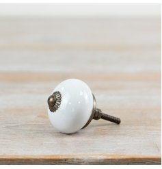 Sleek white door knob with a modern design for a chic, clean look.