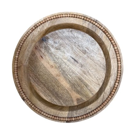 a charming wooden plate with bead edging 