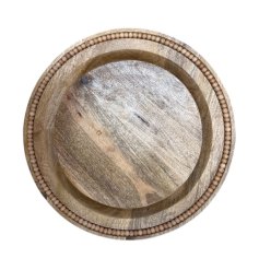 a charming wooden plate with bead edging 
