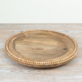 Delightful wooden plate featuring elegant bead trim design.
