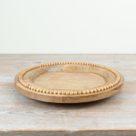a charming wooden beaded plate 