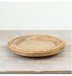 a charming wooden beaded plate 