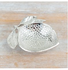 A deep, lemon shaped trinket dish. Detailed with texture and pattern. 
