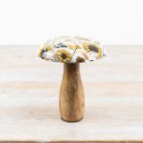 A rustic wooden mushroom ornament with a bold and beautiful enamel sunflower cap. 