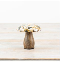 A rustic wooden mushroom with a colourful enamel cap featuring a warm yellow sunflower pattern. 