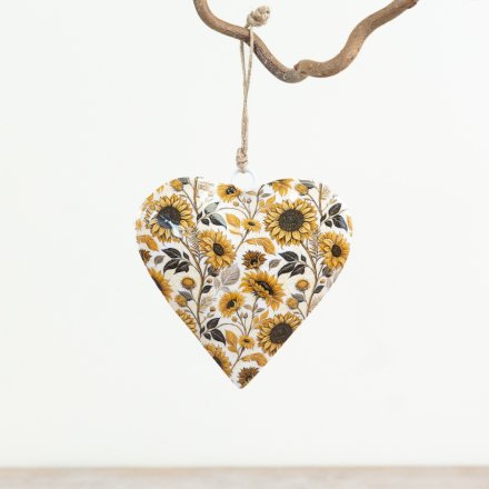 Add a charming touch to any space with this sturdy iron hanging heart
