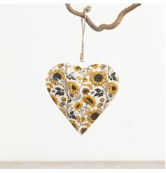 Add a charming touch to any space with this sturdy iron hanging heart
