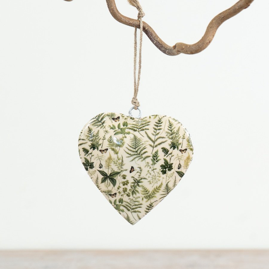 Delightful iron heart ornament with a sleek, glossy enamel coating for hanging display.