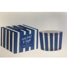 Bring cozy charm and style to your space with this Blue Stripe Candle.