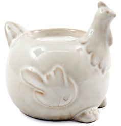 Add a cozy charm to your space with this 9x9cm cream B/te Chicken T-light Holder