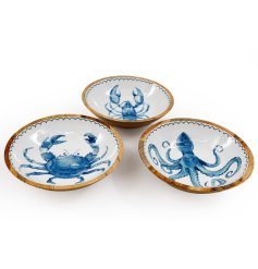 A mix of 3 wooden coastal bowls featuring vibrant enamel tops for a stylish touch.