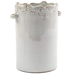 Keep your kitchen tidy with this cream utensil holder 
