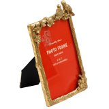 Capture cherished moments with elegance in this 4x6 Gold Lovebirds Photo Frame