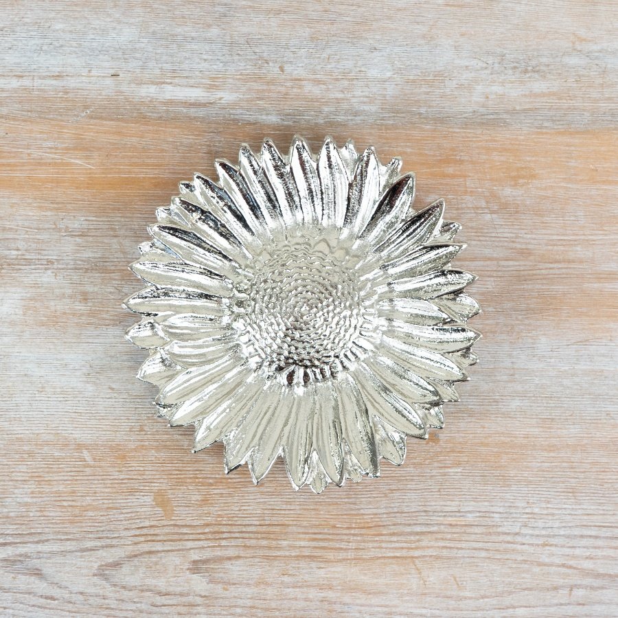 Elegant flower dish featuring a sleek silver tone and intricate sunflower pattern.