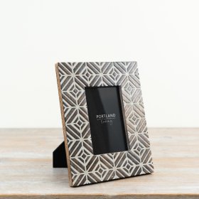 Chic whitewashed frame perfect for showcasing your favorite photos.