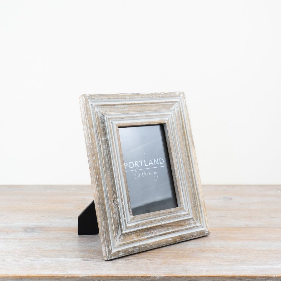 Whitewashed frame with a charming rustic design.