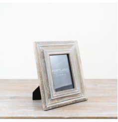 Whitewashed frame with a charming rustic design