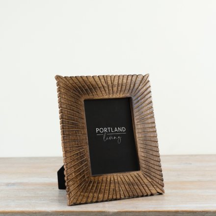 Stylish 5x7 wooden photo frame featuring a polished finish and a clear glass front.