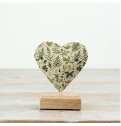 A stylish heart mounted on a wooden base 