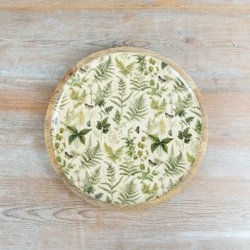 A lovely green serving plate adorned with botanical herb designs.