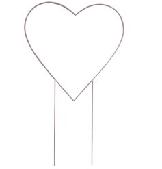 A rustic iron heart stake designed to help flowers trail around the outline. 