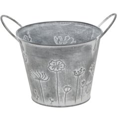 Elegant grey iron pot with sturdy handles for easy grip. 