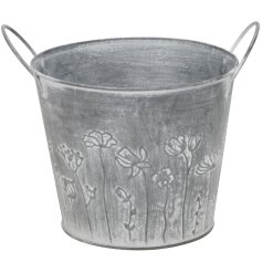 Charming grey metal flower pot  perfect for indoor or outdoor use.