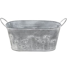 Oval rustic metal bowl featuring a sleek silver finish