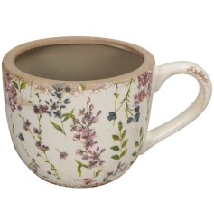 a stylish mug planter with floral design pattern 