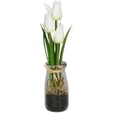 Made to last, these faux tulips potted in a clear glass vase add a touch of freshness to the home. 
