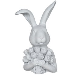 Bring a touch of spring charm to your home with this adorable White Rabbit Holding Roses figurine