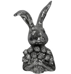 a sulver resin rabbit figurine holding flowers 