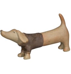 Add warmth and charm to your home with the Dog Ornament