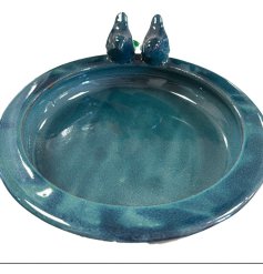 Add charm and color to your garden with this blue glazed earthenware bird bath