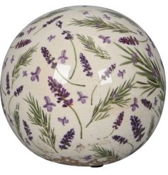 A decorative stoneware sphere with a rustic aesthetic and country cottage style lavender pattern. 
